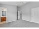 Spacious bedroom with neutral carpet and gray walls; ensuite bathroom and walk-in closet access at 3044 Lauren Parc Rd, Decatur, GA 30032