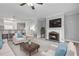 Cozy living room features a fireplace, hardwood floors, and access to the kitchen bar at 3044 Lauren Parc Rd, Decatur, GA 30032