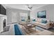 Bright living room features a fireplace, comfortable seating, ceiling fan, and stylish décor at 3044 Lauren Parc Rd, Decatur, GA 30032