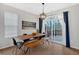 Bright dining room with hardwood floors and sliding glass doors to deck at 108 Rex Ave, Canton, GA 30114