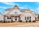 Two story house with brick and beige siding, front porch, and landscaping at 108 Rex Ave, Canton, GA 30114