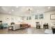 Finished basement with living room, hardwood floors, and multiple seating options at 159 Geneva Rd, Canton, GA 30114