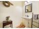 Elegant powder room with pedestal sink and decorative mirror at 159 Geneva Rd, Canton, GA 30114