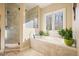 Bright bathroom with a large soaking tub and walk in shower at 159 Geneva Rd, Canton, GA 30114