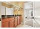 Well-lit bathroom with double vanity and built-in shelving at 159 Geneva Rd, Canton, GA 30114