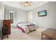 Bright bedroom with a double bed, TV, and wood furniture at 159 Geneva Rd, Canton, GA 30114