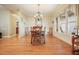 Formal dining room with hardwood floors and elegant chandelier at 159 Geneva Rd, Canton, GA 30114