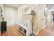 Entryway with hardwood floors, bench, and floor lamp at 159 Geneva Rd, Canton, GA 30114