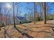 Rear exterior showcasing the home's serene wooded surroundings and privacy at 159 Geneva Rd, Canton, GA 30114