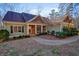 Two story home with stone and siding exterior, covered porch and landscaping at 159 Geneva Rd, Canton, GA 30114