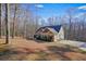 House with a large yard and driveway located on a hillside at 159 Geneva Rd, Canton, GA 30114