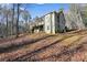 Two story house with deck, screened porch, and stairs leading down to backyard at 159 Geneva Rd, Canton, GA 30114