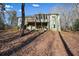 House with deck, screened porch, and stairs leading down to backyard at 159 Geneva Rd, Canton, GA 30114