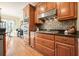 Well-equipped kitchen with gas cooktop and wood cabinetry at 159 Geneva Rd, Canton, GA 30114