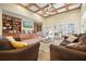 Open living room with built-in shelving, hardwood and carpeted floors, and ample natural light at 159 Geneva Rd, Canton, GA 30114