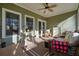 Bright screened porch features ceiling fan, comfy seating, and outdoor access at 159 Geneva Rd, Canton, GA 30114
