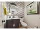 Stylish powder room with patterned wallpaper and modern vanity at 3745 Homestead Ridge Dr, Cumming, GA 30041