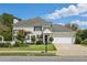 Craftsman style home with a two car garage and well-maintained landscaping at 3745 Homestead Ridge Dr, Cumming, GA 30041