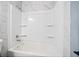 Clean bathroom with white bathtub/shower and marble-style tile at 4242 Clearview Dr, Douglasville, GA 30134