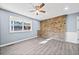 Bright living room with wood floors and ceiling fan at 4242 Clearview Dr, Douglasville, GA 30134