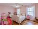 Charming bedroom with a pink color scheme and hardwood floors at 2964 Orr Dr, Atlanta, GA 30344