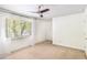 Bright bedroom with ceiling fan and neutral carpeting at 6940 Roswell Rd # 16B, Atlanta, GA 30328
