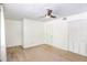 Bright bedroom with ceiling fan and neutral carpeting at 6940 Roswell Rd # 16B, Atlanta, GA 30328