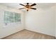 Bright bedroom with ceiling fan and neutral carpeting at 6940 Roswell Rd # 16B, Atlanta, GA 30328
