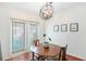 Cozy dining area with a round table, chairs, and globe chandelier at 6940 Roswell Rd # 16B, Atlanta, GA 30328