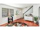 Inviting entryway with hardwood floors, storage, and a staircase at 6940 Roswell Rd # 16B, Atlanta, GA 30328
