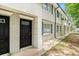 Well-maintained building exterior with brick facade and landscaping at 6940 Roswell Rd # 16B, Atlanta, GA 30328