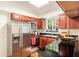 Updated kitchen with stainless steel appliances and wood cabinets at 6940 Roswell Rd # 16B, Atlanta, GA 30328