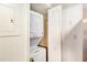 White stackable washer and dryer in a small closet at 6940 Roswell Rd # 16B, Atlanta, GA 30328