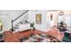 Open living space with hardwood floors, a staircase, and dining area at 6940 Roswell Rd # 16B, Atlanta, GA 30328