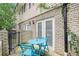 Private patio with blue table and chairs at 6940 Roswell Rd # 16B, Atlanta, GA 30328