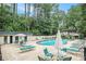 Community pool area with lounge chairs and umbrellas at 6940 Roswell Rd # 16B, Atlanta, GA 30328