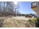 Private backyard with spacious patio and wooded views at 200 Wallace St, Fayetteville, GA 30214
