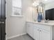 Bathroom with double vanity and gray tile flooring at 200 Wallace St, Fayetteville, GA 30214