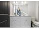 Bathroom boasts double sinks, white cabinets, and a large mirror at 200 Wallace St, Fayetteville, GA 30214