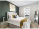 Bright bedroom with a queen-size bed and stylish decor at 200 Wallace St, Fayetteville, GA 30214