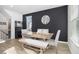 Dining area with wood table, bench, and dark accent wall at 200 Wallace St, Fayetteville, GA 30214
