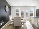 Bright dining room features a table with six chairs and access to a deck at 200 Wallace St, Fayetteville, GA 30214