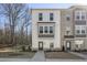 Three-story townhome with brick and siding accents at 200 Wallace St, Fayetteville, GA 30214
