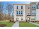 Charming new construction townhome with manicured lawn and tree-lined surroundings at 200 Wallace St, Fayetteville, GA 30214