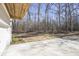 Attached garage with concrete driveway and wooded backdrop at 200 Wallace St, Fayetteville, GA 30214