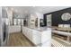 Open kitchen with white cabinets and large island at 200 Wallace St, Fayetteville, GA 30214