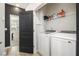 Bright laundry room with washer, dryer, and ample storage at 200 Wallace St, Fayetteville, GA 30214