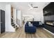 Spacious living room with fireplace and blue sectional sofa at 200 Wallace St, Fayetteville, GA 30214