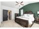 Main bedroom with king-size bed, carpet flooring, and an ensuite bathroom at 200 Wallace St, Fayetteville, GA 30214