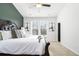 Spacious main bedroom with a king-size bed and an accent wall at 200 Wallace St, Fayetteville, GA 30214